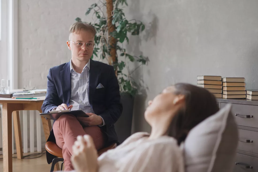 side-view-young-man-using-mobile-phone-while-sitting-home