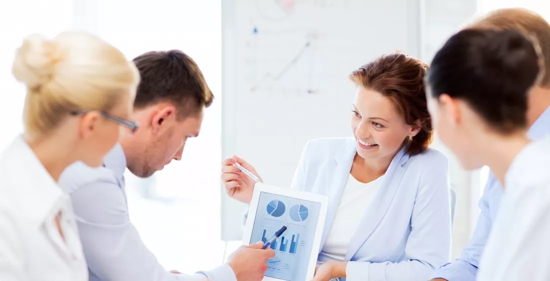 friendly-business-team-discussing-graphs-office