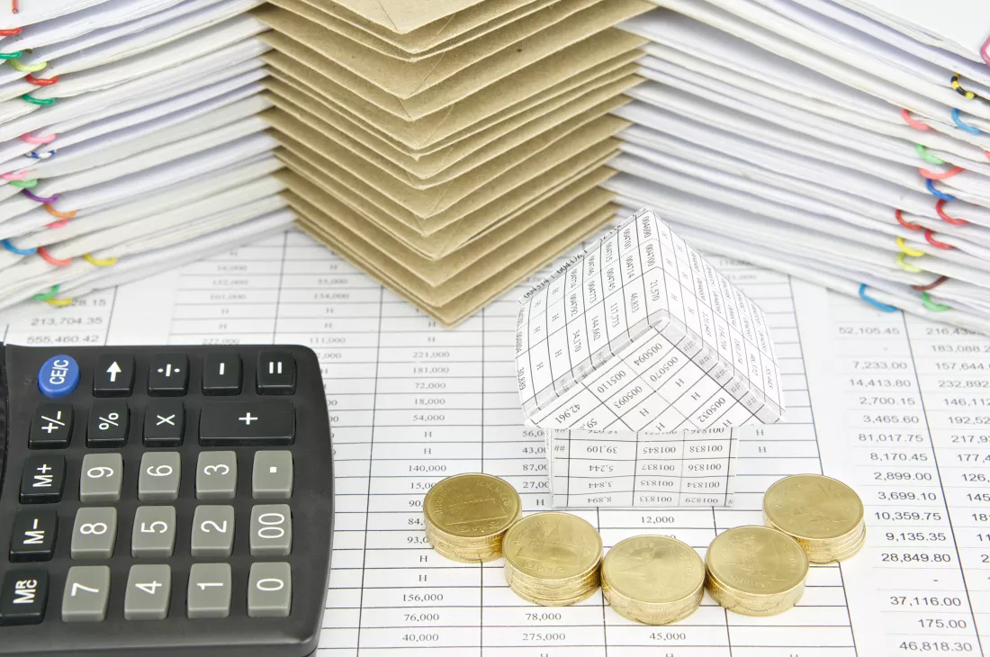 close-up-calculator-coins-documents