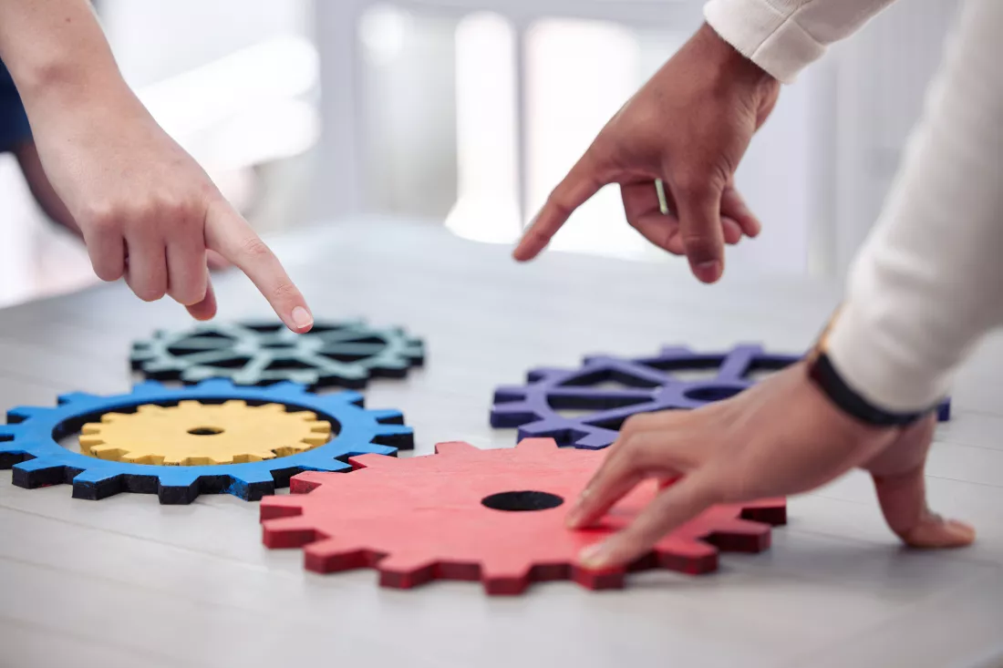 teamwork-is-ability-work-together-toward-common-vision-shot-two-business-man-working-with-mechanisms-office